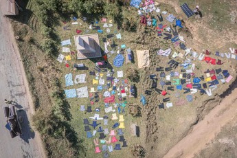 Like a colourful puzzle of textiles, an open-air laundry spreads out near Antananarivo - from the bird's-eye view, the traditional Malagasy method of drying clothes becomes a vibrant mosaic, with countless of garments neatly laid out on the meadow to dry in the tropical sun.