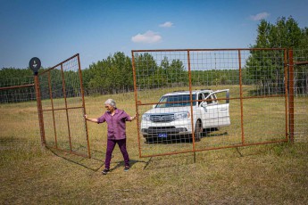 Lilyrose opens the gate to a spacious enclosure so that we can experience the very rare white bison (Bison leucistic) up close.