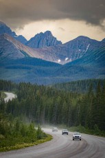 It could almost be an advert for a car: a winding road snakes through the picturesque valley towards Kananaskis, Alberta.