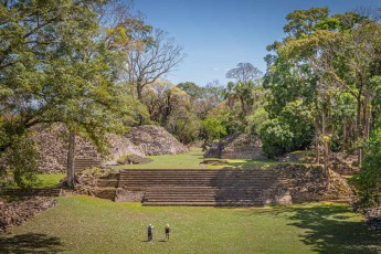 Guides Andres and Annette walk along the step pyramids of Lubaantún – stones held together by nothing but gravity since the 8th century.