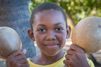 Jenard Sanchez, ten years old, holds two shakers up in the afternoon air of Hopkins.